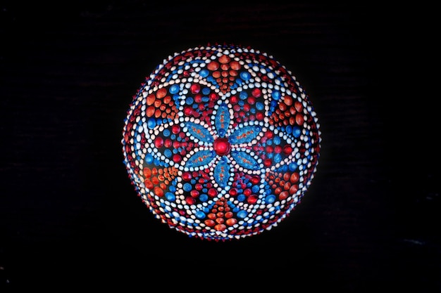 Beautiful hand painted mandala on black background