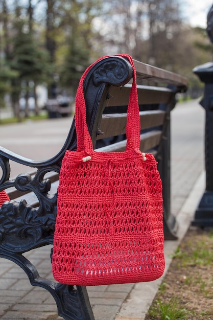 Beautiful handmade bag hanging on the bench