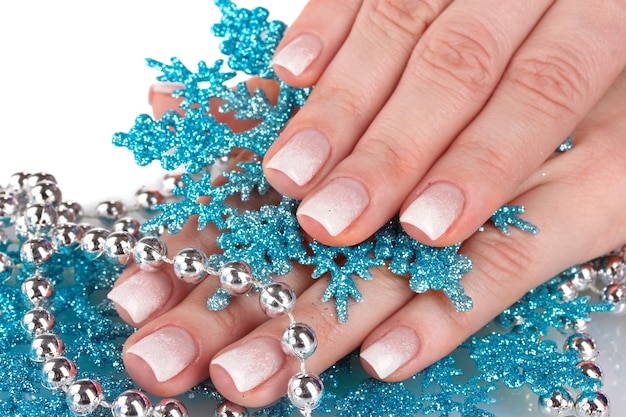 Beautiful hands and snowflakes and beads isolated on white