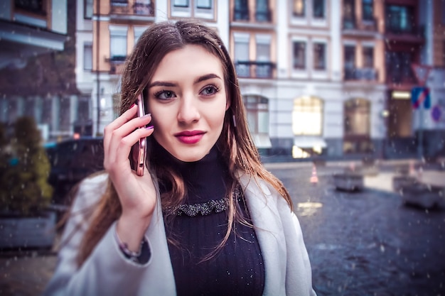 Beautiful and happy business woman talking on the phone