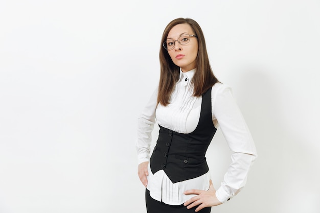 Beautiful happy caucasian young smiling brown-hair business woman in black suit, white shirt and glasses looking camera isolated on white background. Manager or worker. Copy space for advertisement.