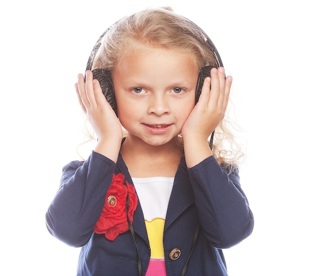 Beautiful happy little girl with headphones Isolated on white