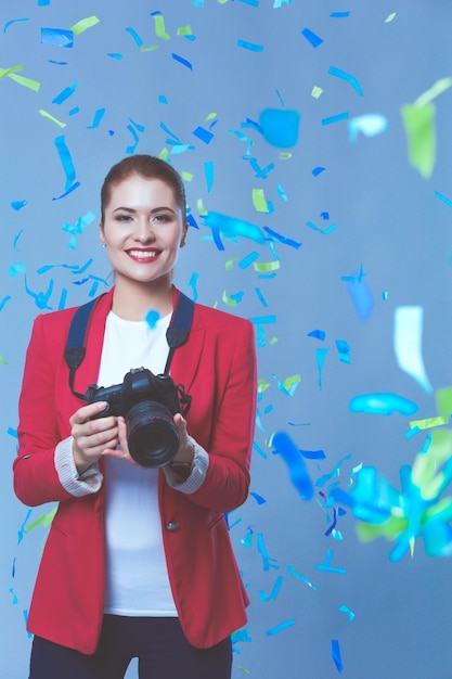 Beautiful happy woman at celebration party with confetti Birthday or New Year eve celebrating concept