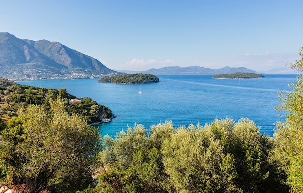 Beautiful hazy summer Lefkada coastline landscape (Nydri, Greece, Ionian Sea).