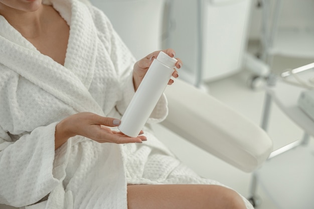 Beautiful healthy smiling caucasian woman is doing beauty procedures at spa and healthcare salon