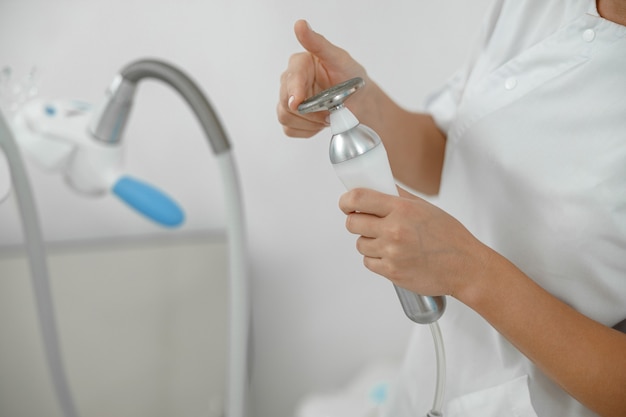 Beautiful healthy smiling caucasian woman is doing beauty procedures at spa and healthcare salon