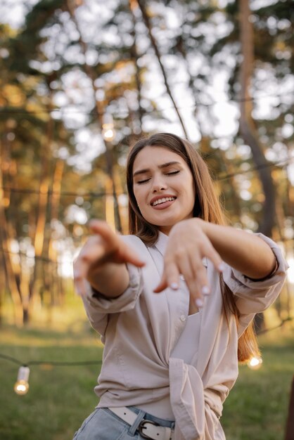 Beautiful hippie girl dancing at a friends party