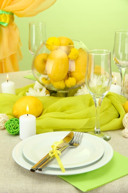 Beautiful holiday table setting with lemons close up