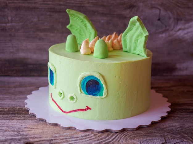 beautiful homemade cake in the shape of a dinosaur