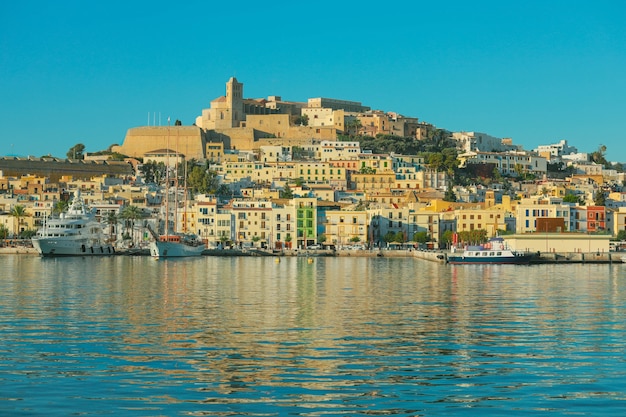 Beautiful Ibiza town with blue Mediterranean sea city view in the morning