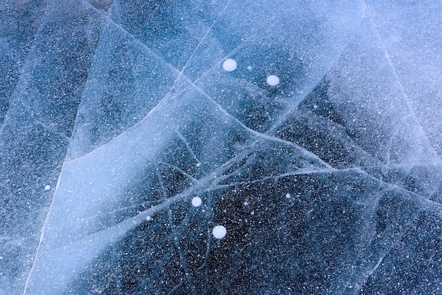 Beautiful ice of lake baikal with abstract cracks