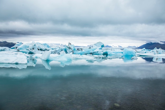 Beautiful icebergs on Jokulsarlon Ice Lake in the golden circle of southern Iceland on a cold August morning