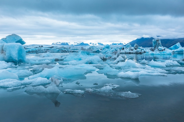 Beautiful icebergs on Jokulsarlon Ice Lake in the golden circle of southern Iceland on a cold August morning