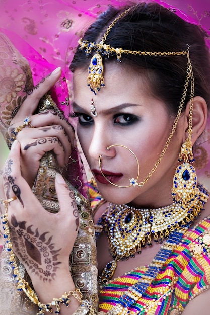 Beautiful indian girl Young hindu woman model with kundan jewelry.