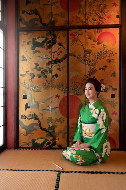 Beautiful japanese woman in a green kimono