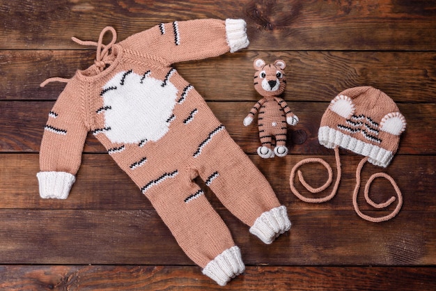 Beautiful knitted tiger from threads. Toy made with your own hands in the year of tiger 2022