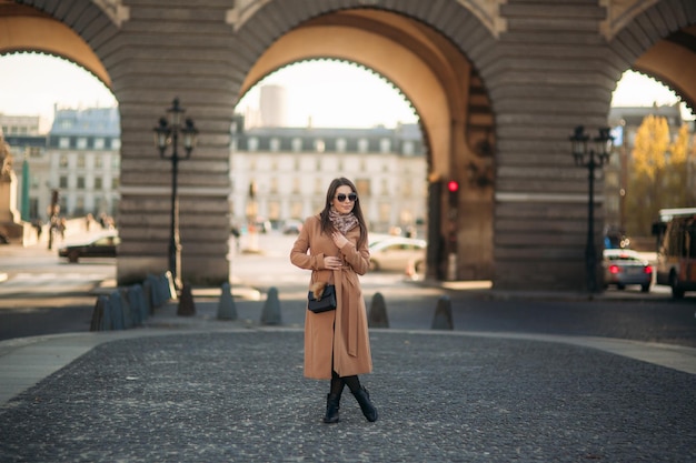 Beautiful lady stay in centre of the city sunny autumn day