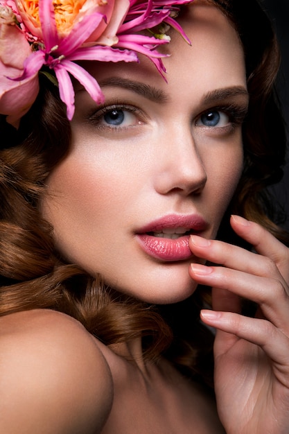 Beautiful lady with a wreath of flowers