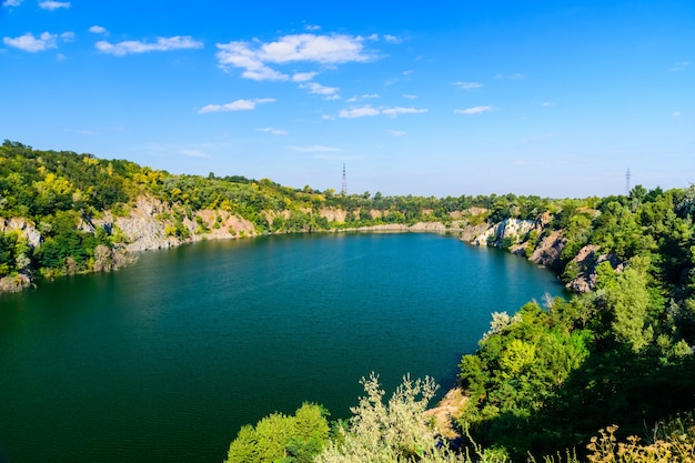 Beautiful lake in the abandoned granite quarry on summer