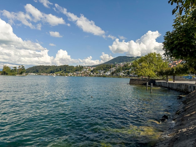 The beautiful Lake Zurich with snowwhite clouds in the sky