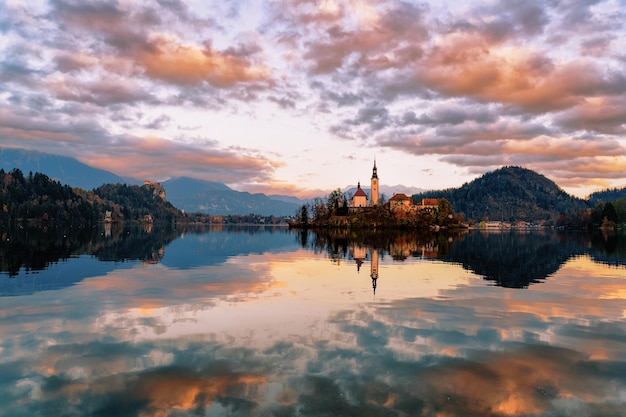 Beautiful landscape and Bled Lake and Church with Castle in Slovenia. Travel in Europe at sunset