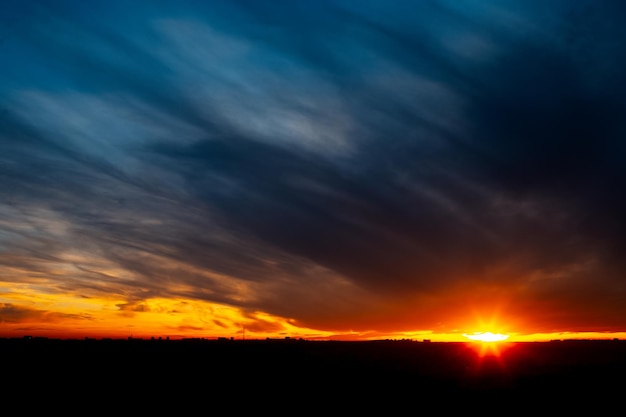 Beautiful landscape of dark sunset or sunrise with clouds