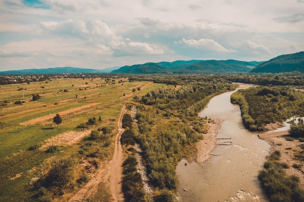 Beautiful landscape from the top shows the river and field in the countryside