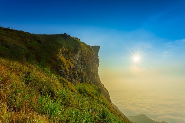 Beautiful landscape nature on peak mountain with sunset in winter at viewpoint Phu Chi Fa or Phu