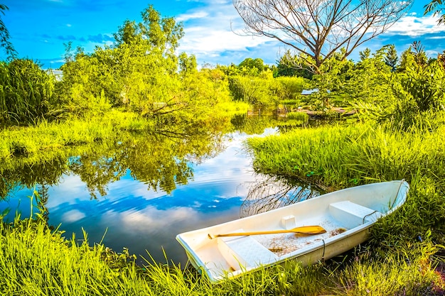 The beautiful landscape ofmall wooden rowing boat on a calm lake