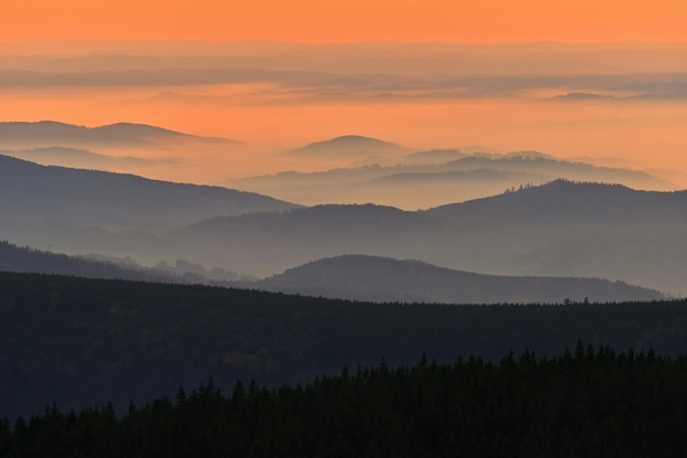 Beautiful landscape and sunset in the mountains Hills in clouds Jeseniky Czech Republic Europe