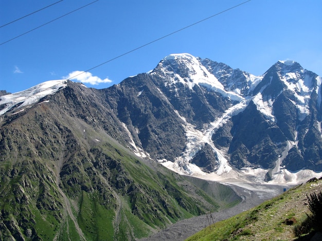 Beautiful landscape, view of Mount Cheget from village of Terskol. High mountain with snowy peaks