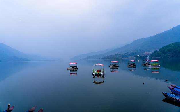 Beautiful landscape view of Phewa lake and boats at Pokhara Nepal