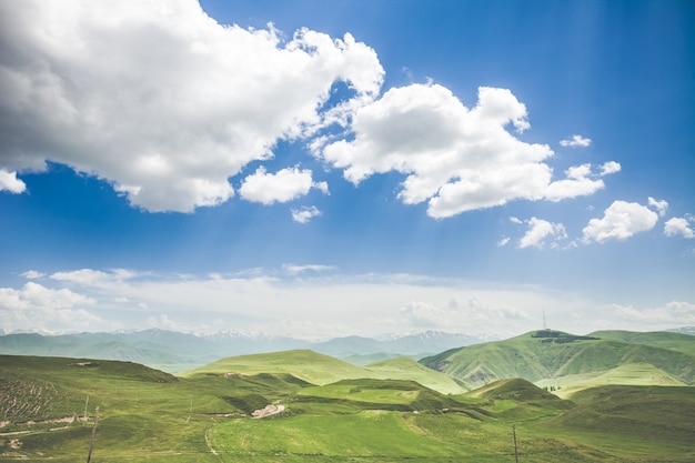 Beautiful landscape with green mountains and magnificent cloudy sky exploring armenia