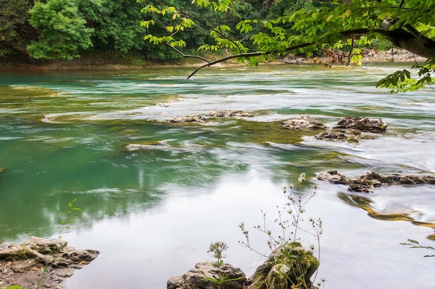 Beautiful landscape with a mountain river on a summer day shot on a long exposure