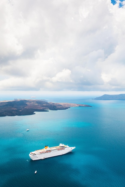 Beautiful landscape with sea view. Cruise ship at sea. Santorini island, Greece.