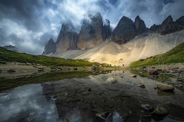 Beautiful landscapes view of reflection of mountain on the river with blue sky on summer from Tre Cime, Dolomites, Italy.