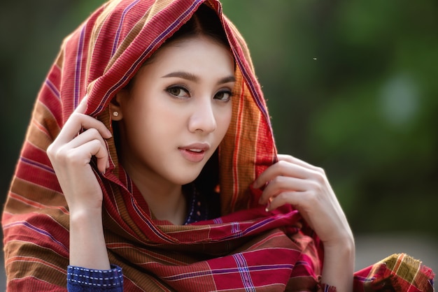 Beautiful Laos girl in Laos traditional costume, vintage style at Vientiane, Laos. 