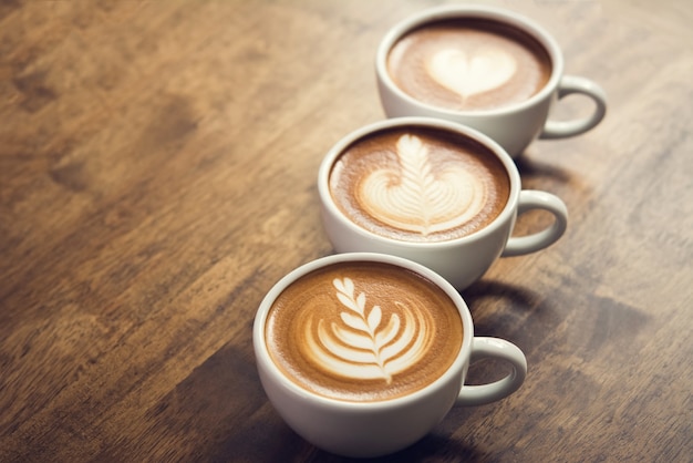 Beautiful latte art coffees on the table