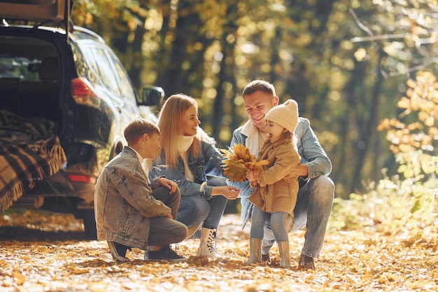 Beautiful leaves Happy family is in the park at autumn time together