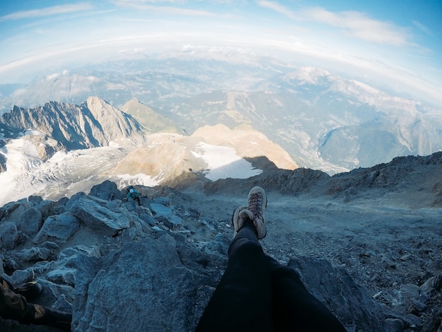 Beautiful legs against the background of mountain peaks