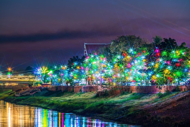 Beautiful light on the Nan River at night on the bridge Naresuan Bridge in Realm for Naresuan the Great Festival and Red Cross Annual event in PhitsanulokThailand