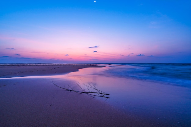 Beautiful Light Sunset or sunrise over sea Colorful dramatic beach scenery Sky with Amazing clouds and waves in sunset sky nature light cloud background