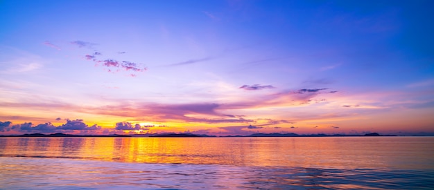 Beautiful light sunset or sunrise over sea scenery nature with reflex in the water surface.