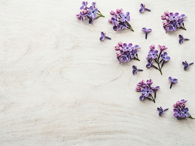 Beautiful lilac lying on a wooden table