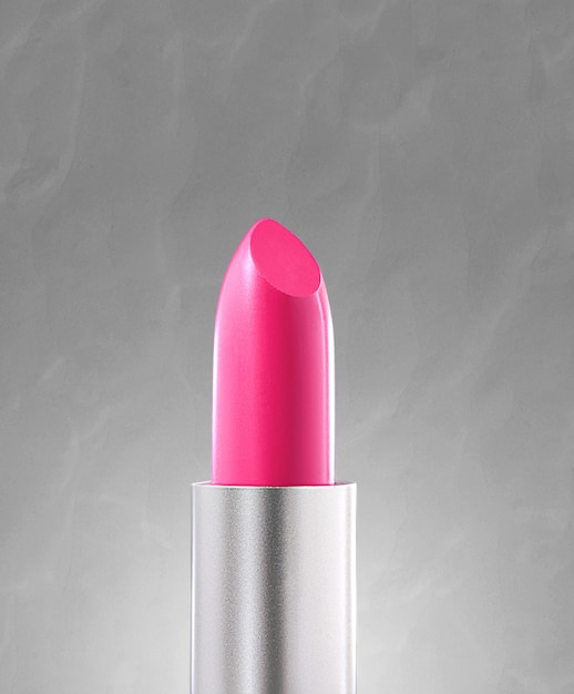 Beautiful lipstick isolated on gray background Makeup product