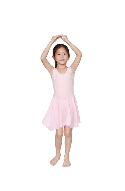 Beautiful little Asian child girl in pink tutu skirt dancing