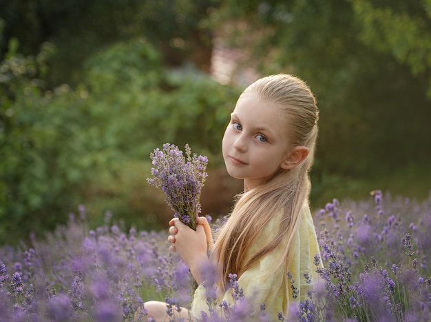 Beautiful little girl on lavender field