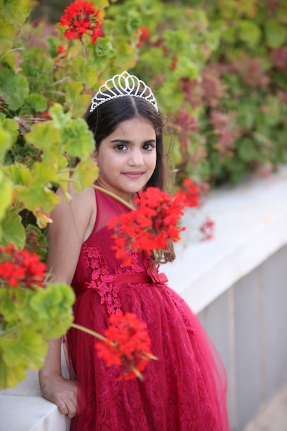 Beautiful Little girl in princess dress with field house park Outdoors