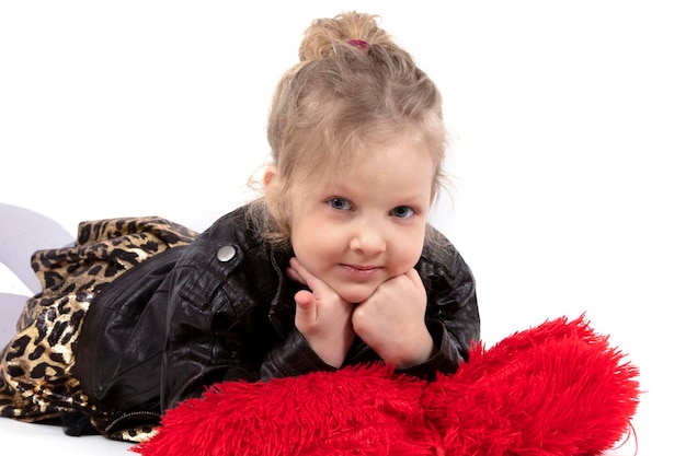 Beautiful little girl on a white background