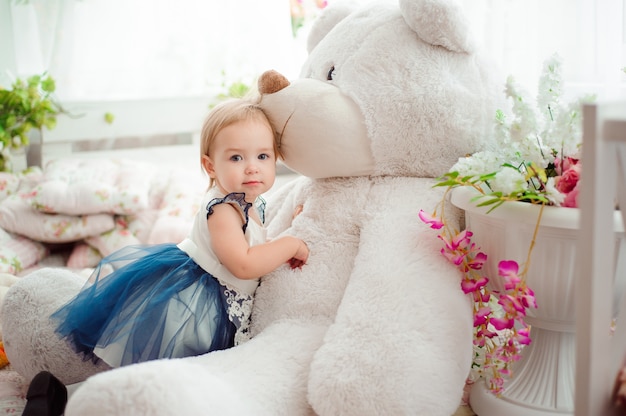 Beautiful little girl with toy smiling